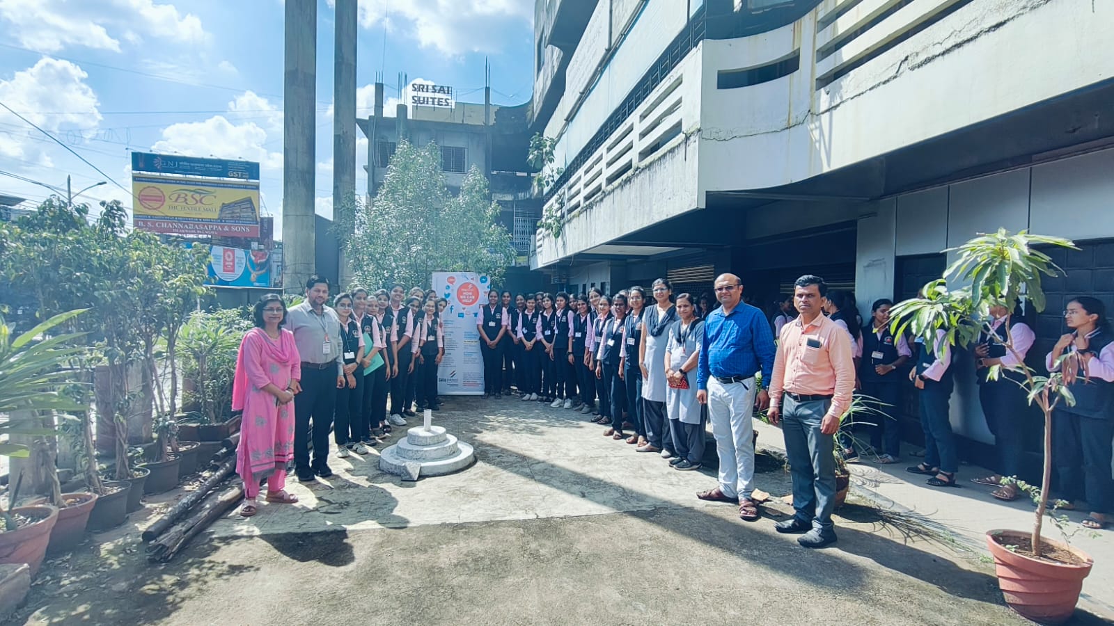 Group photograph of visiting students and staff outside the Satej Infotech office